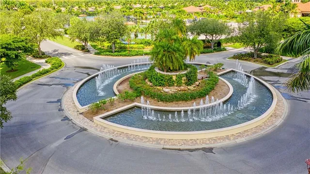 a view of a swimming pool in a backyard