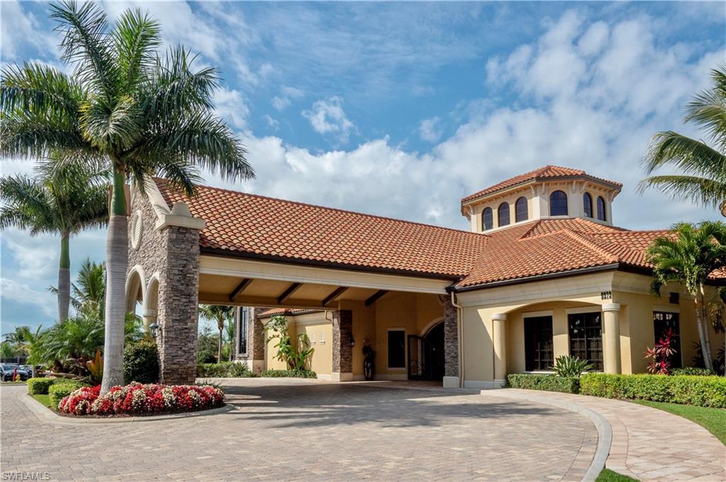 9489 Italia Way Naples, FL 34113 - Photo 44 of 50 a front view of a house with a garden