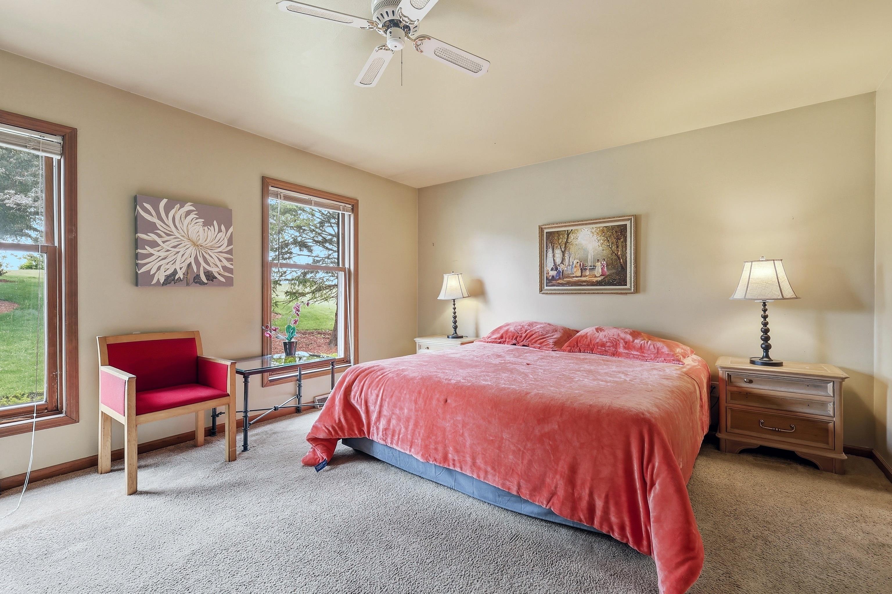 13 Signal Point Lane Galena, IL 61036 - Photo 7 of 47 a bedroom with a bed and a chandelier