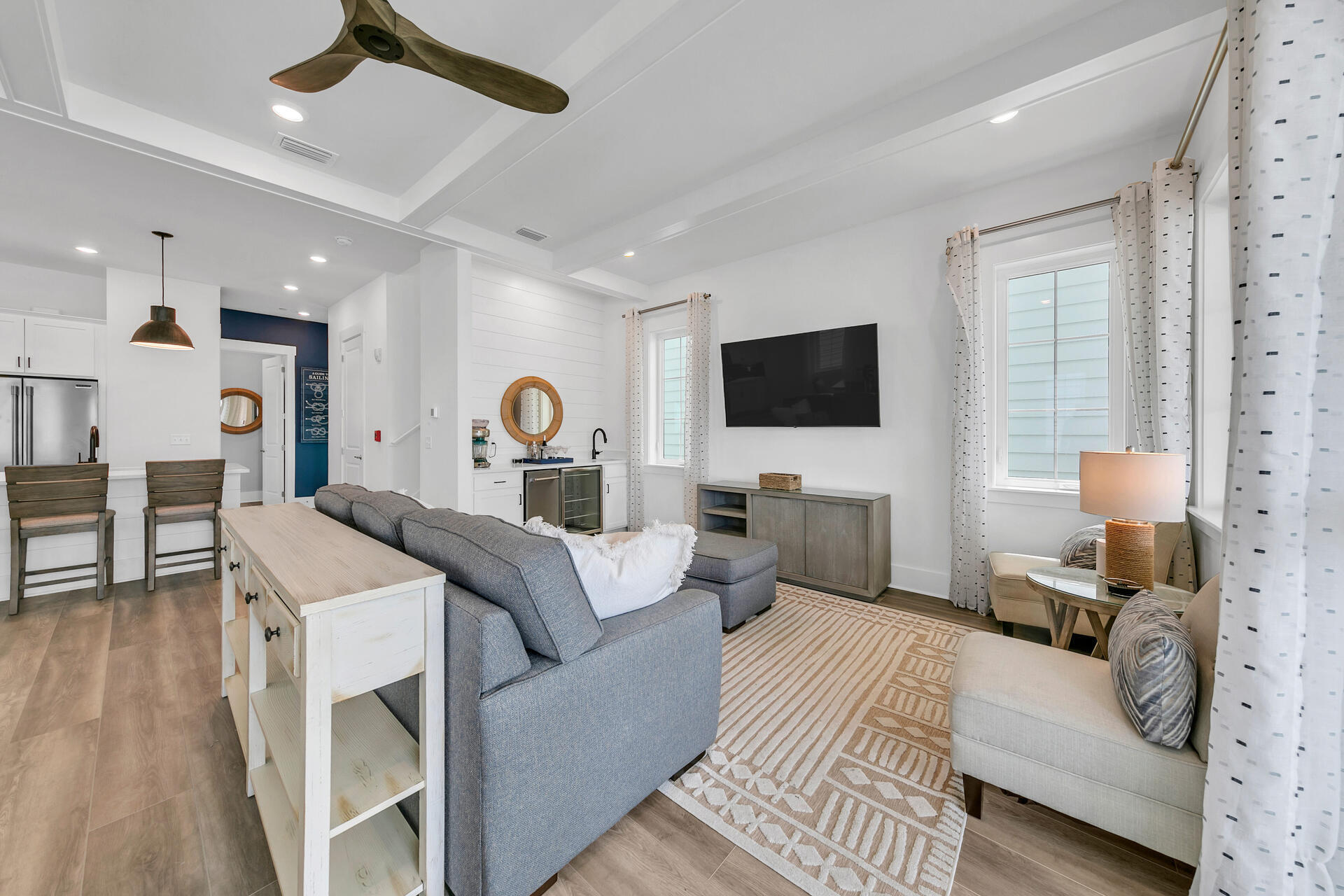 13662 Front Beach Road Panama City Beach, FL 32413 - Photo 11 of 46 a bedroom with a bed a couch and a flat tv screen on dresser