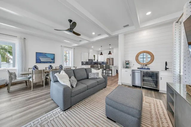 a living room with furniture a couch and a window