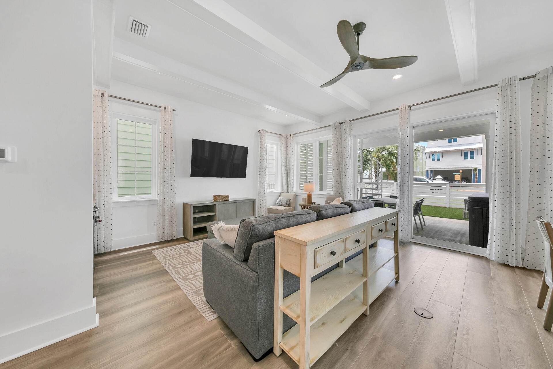 13662 Front Beach Road Panama City Beach, FL 32413 - Photo 13 of 46 a living room with furniture and a flat screen tv