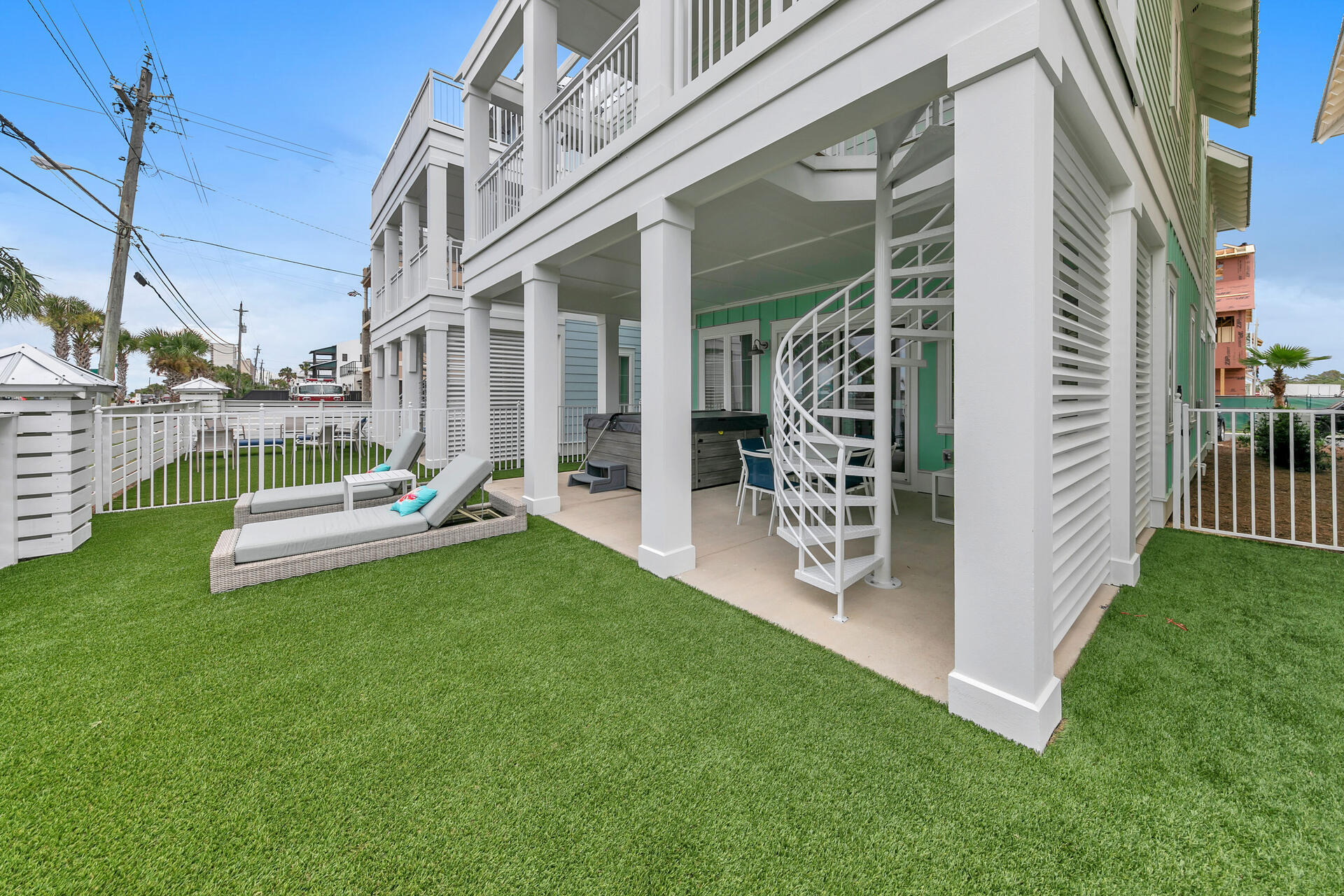 13662 Front Beach Road Panama City Beach, FL 32413 - Photo 15 of 46 a view of a chair and table in backyard of the house