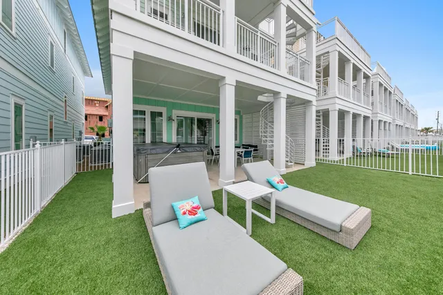 a front view of a house with a yard table and chairs