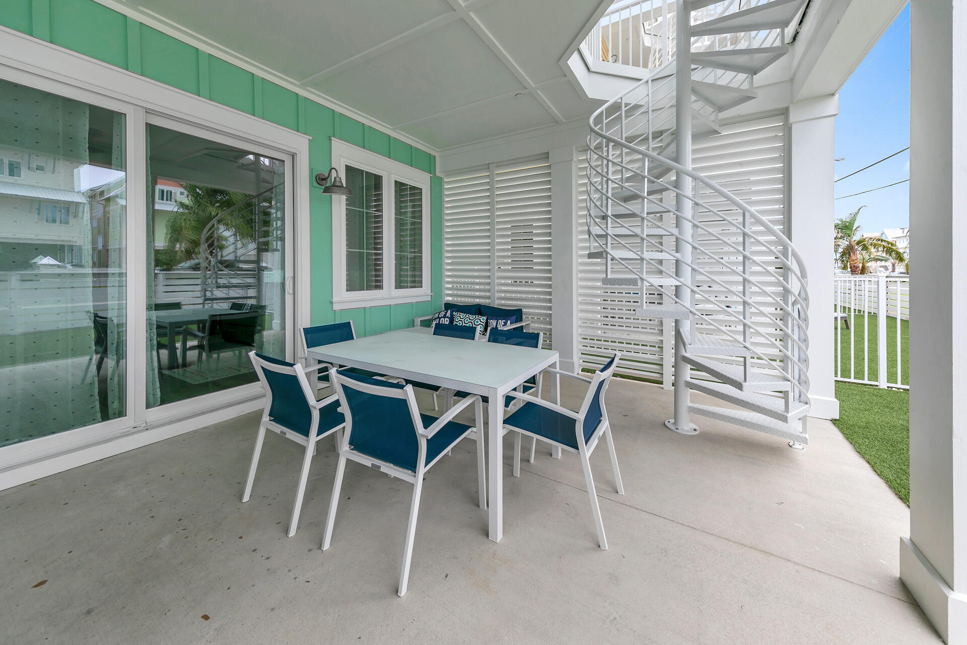 13662 Front Beach Road Panama City Beach, FL 32413 - Photo 17 of 46 a patio with table and chairs and potted plants