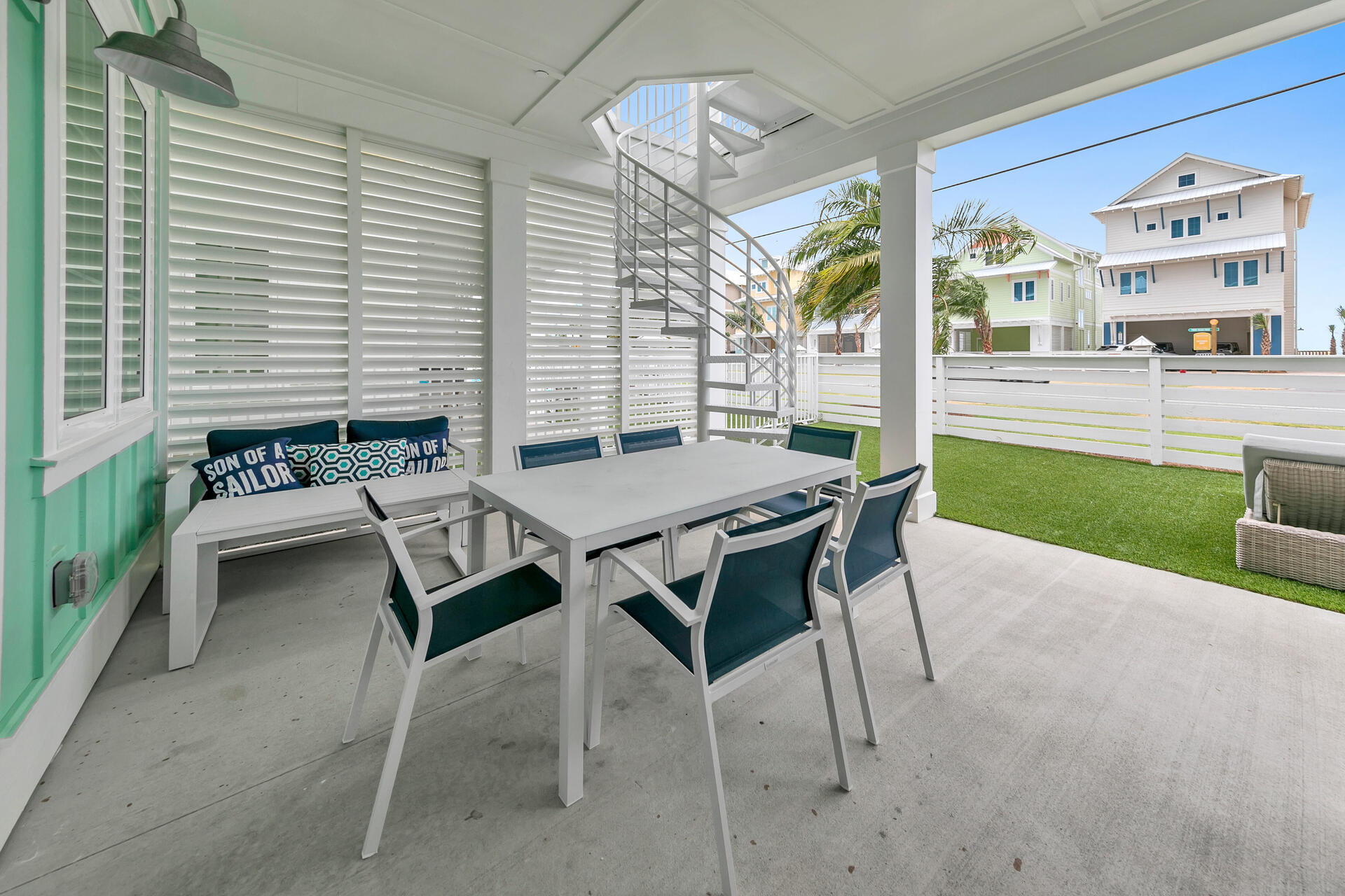 13662 Front Beach Road Panama City Beach, FL 32413 - Photo 18 of 46 a view of a patio with table and chairs and potted plants