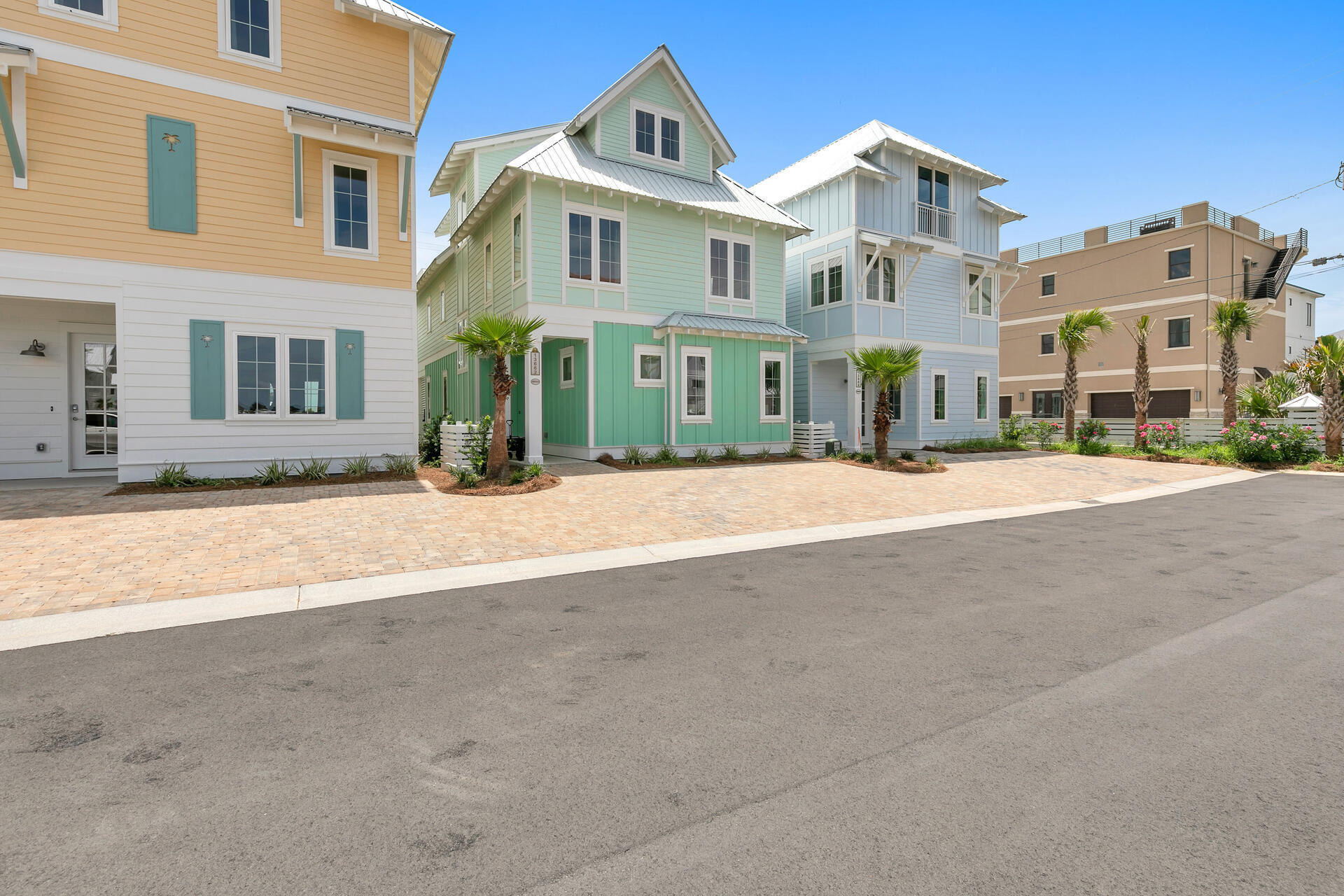 13662 Front Beach Road Panama City Beach, FL 32413 - Photo 2 of 46 a front view of residential houses with yard