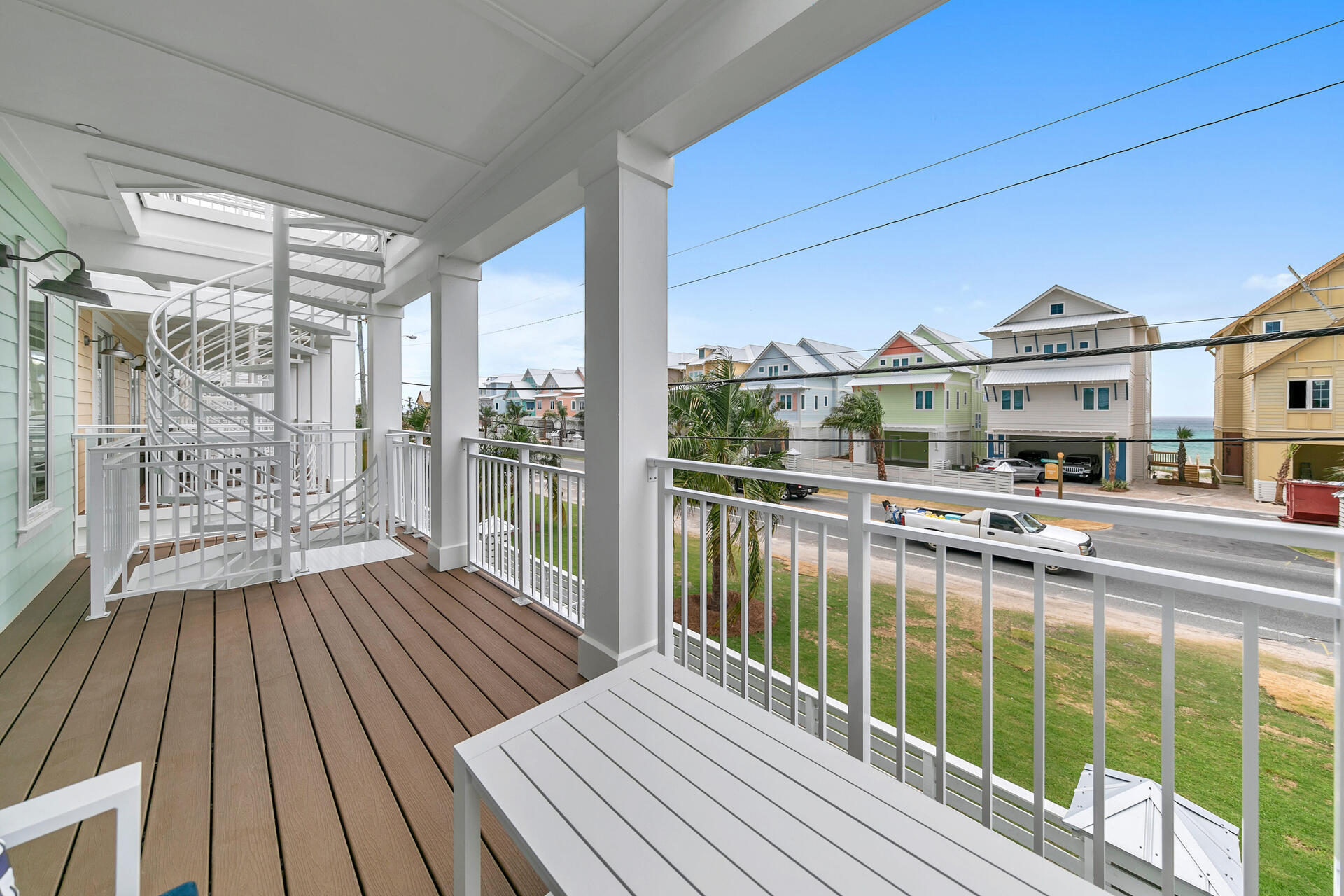 13662 Front Beach Road Panama City Beach, FL 32413 - Photo 24 of 46 a view of a balcony with floor to ceiling windows with wooden floor