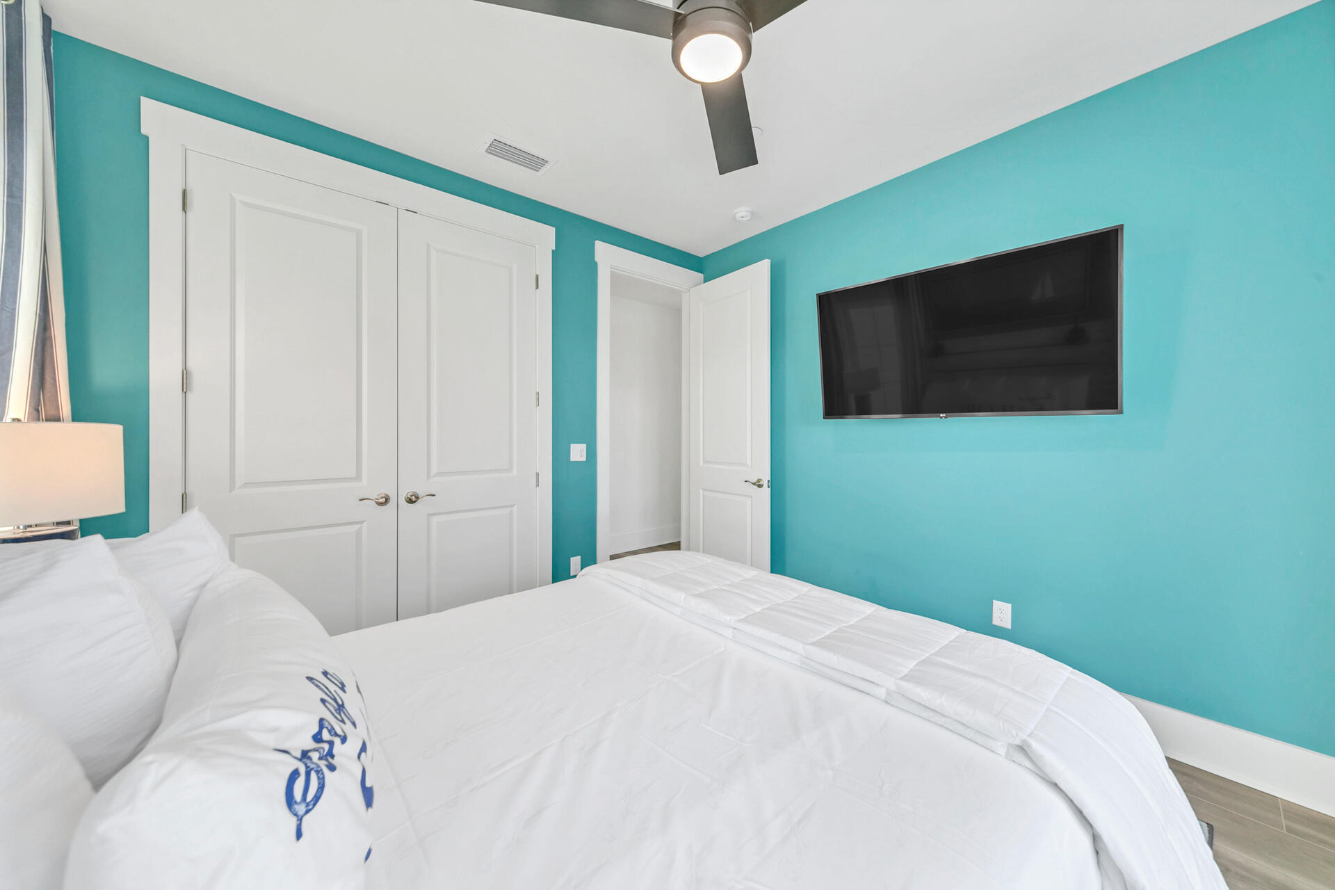13662 Front Beach Road Panama City Beach, FL 32413 - Photo 27 of 46 a bedroom with a bed and a flat screen tv