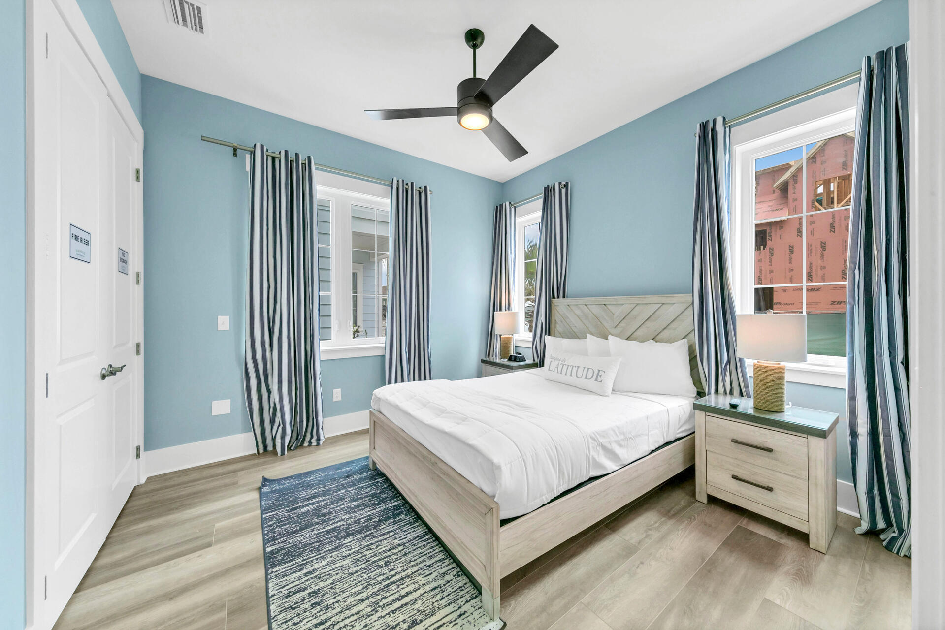 13662 Front Beach Road Panama City Beach, FL 32413 - Photo 34 of 46 a bedroom with a bed and a window