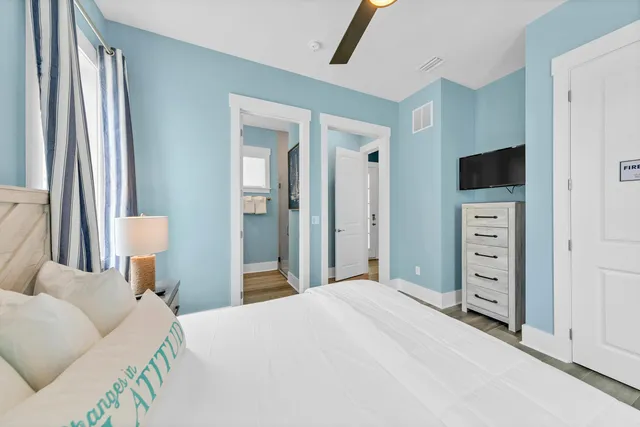 a bedroom with a bed and a television