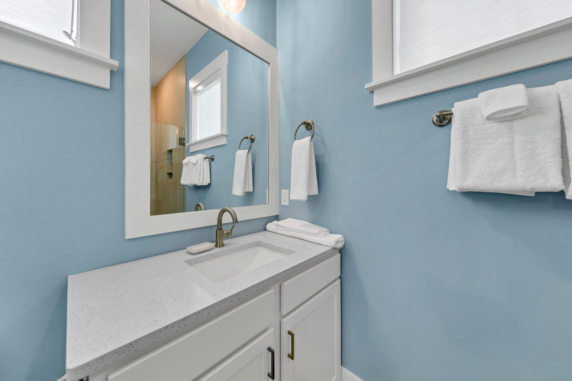 13662 Front Beach Road Panama City Beach, FL 32413 - Photo 36 of 46 a bathroom with a sink and a mirror