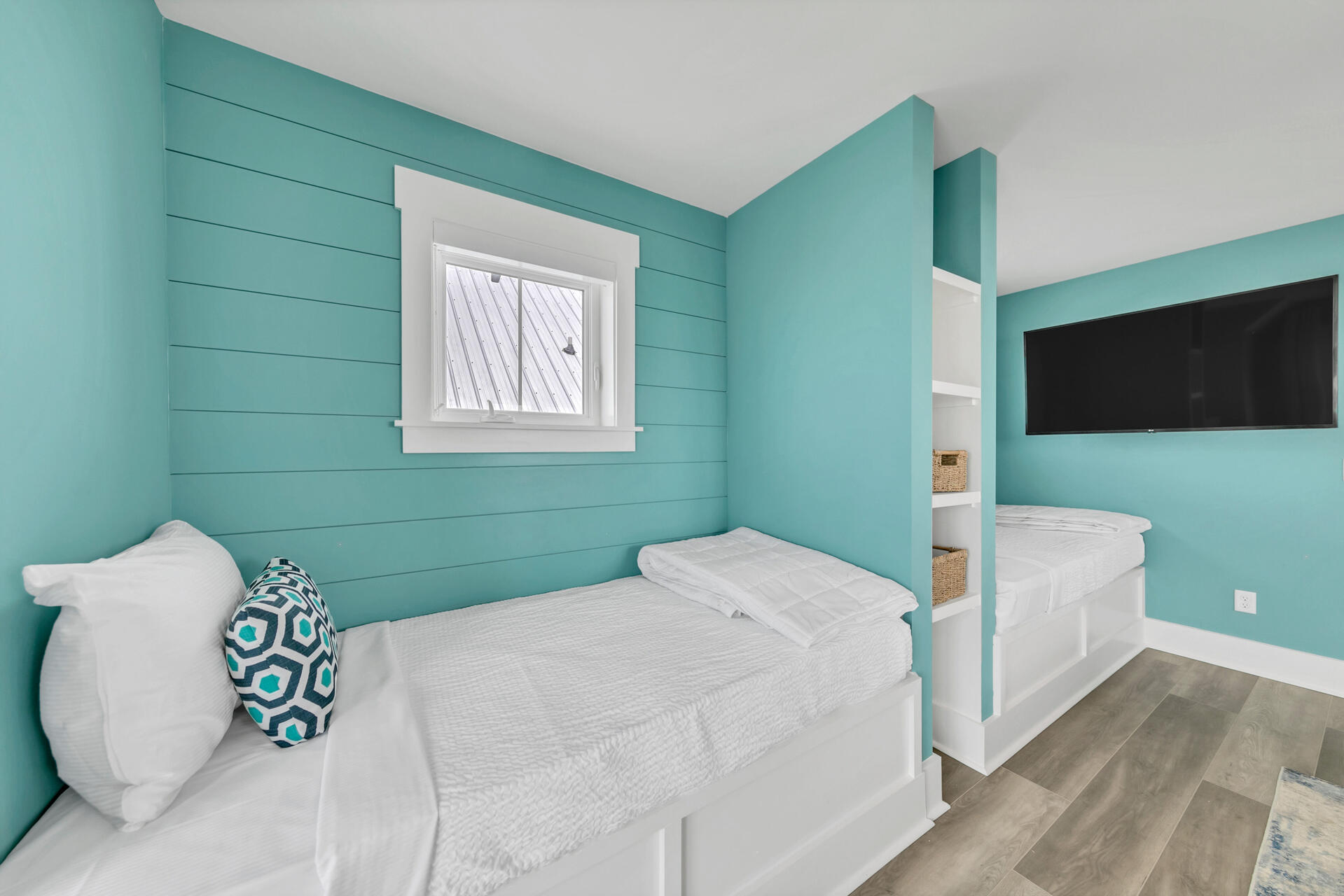 13662 Front Beach Road Panama City Beach, FL 32413 - Photo 41 of 46 a bedroom with a bed and a flat screen tv