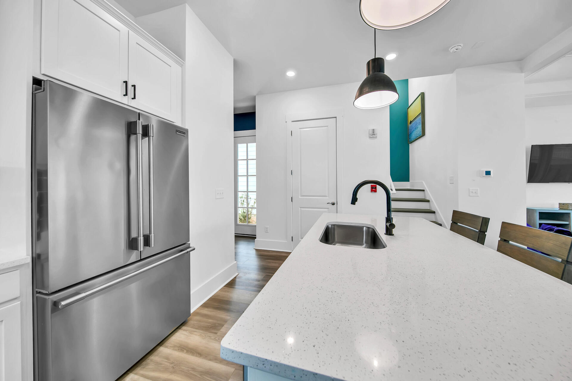 13662 Front Beach Road Panama City Beach, FL 32413 - Photo 7 of 46 a kitchen with stainless steel appliances a refrigerator sink and cabinets
