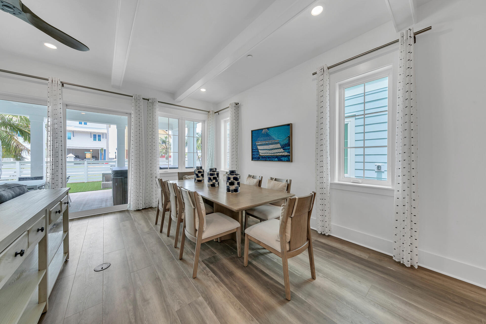 13662 Front Beach Road Panama City Beach, FL 32413 - Photo 9 of 46 a dining room with furniture and wooden floor