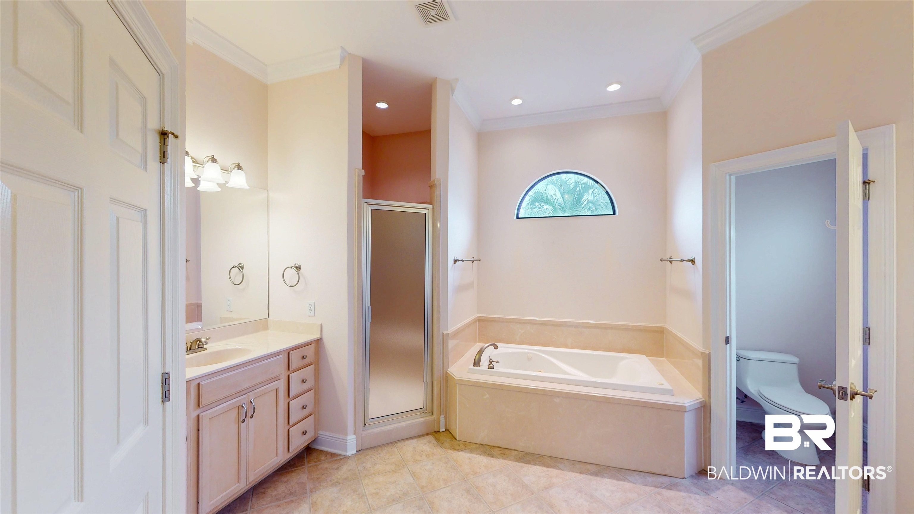 214 Hemingway Loop Foley, AL 36535 - Photo 26 of 67 Full bath featuring vanity, a stall shower, crown molding, a garden tub, and light tile patterned floors