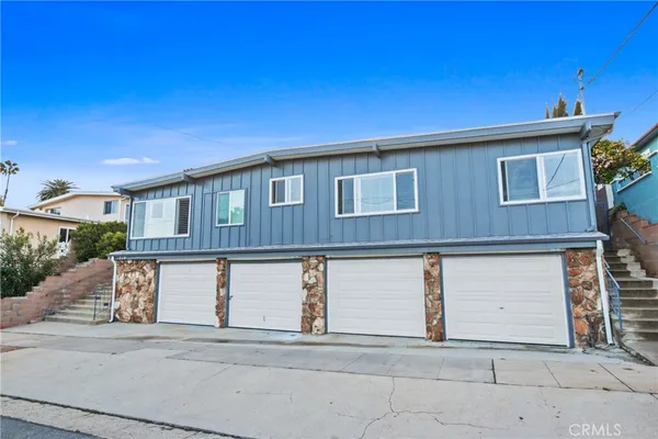 a front view of a house with a garage