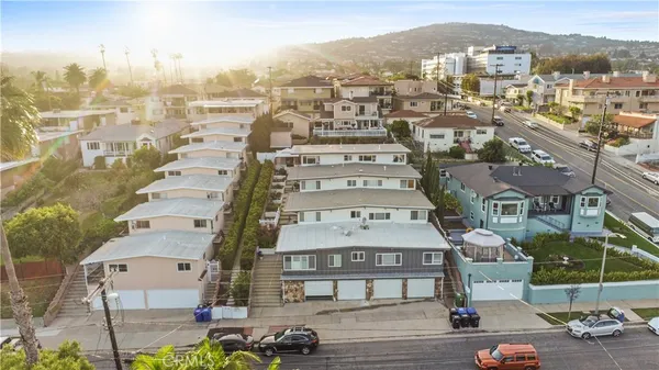 an aerial view of residential building with parking space