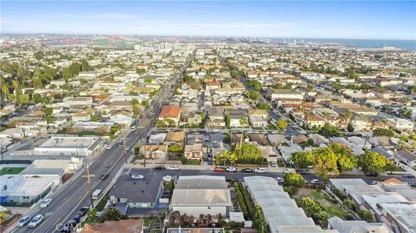 an aerial view of residential houses with city view