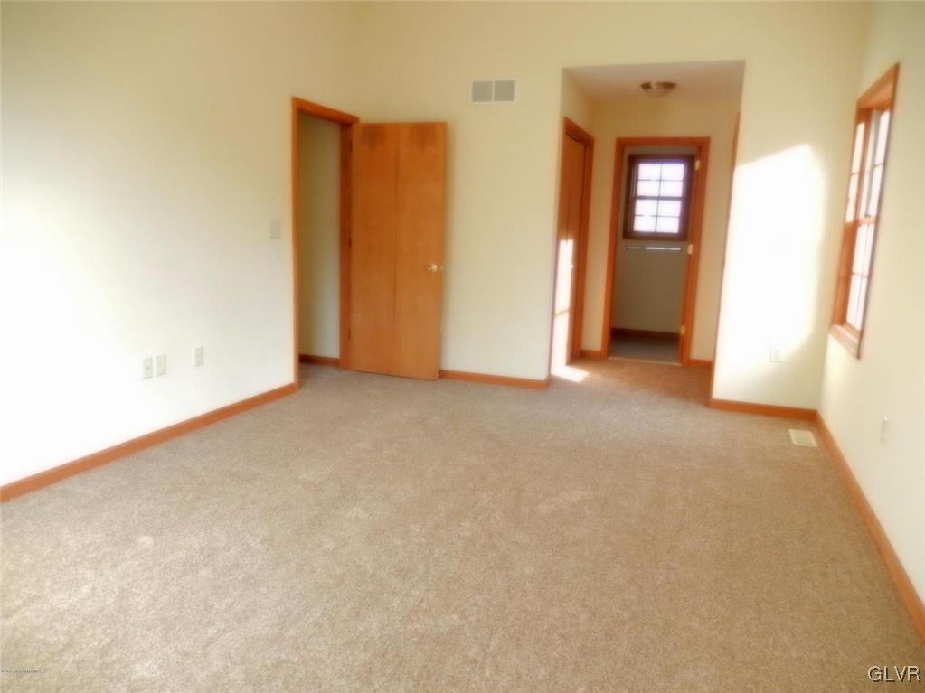 5886 Decker Road Bushkill, PA 18324 - Photo 11 of 15 an empty room with closet and windows