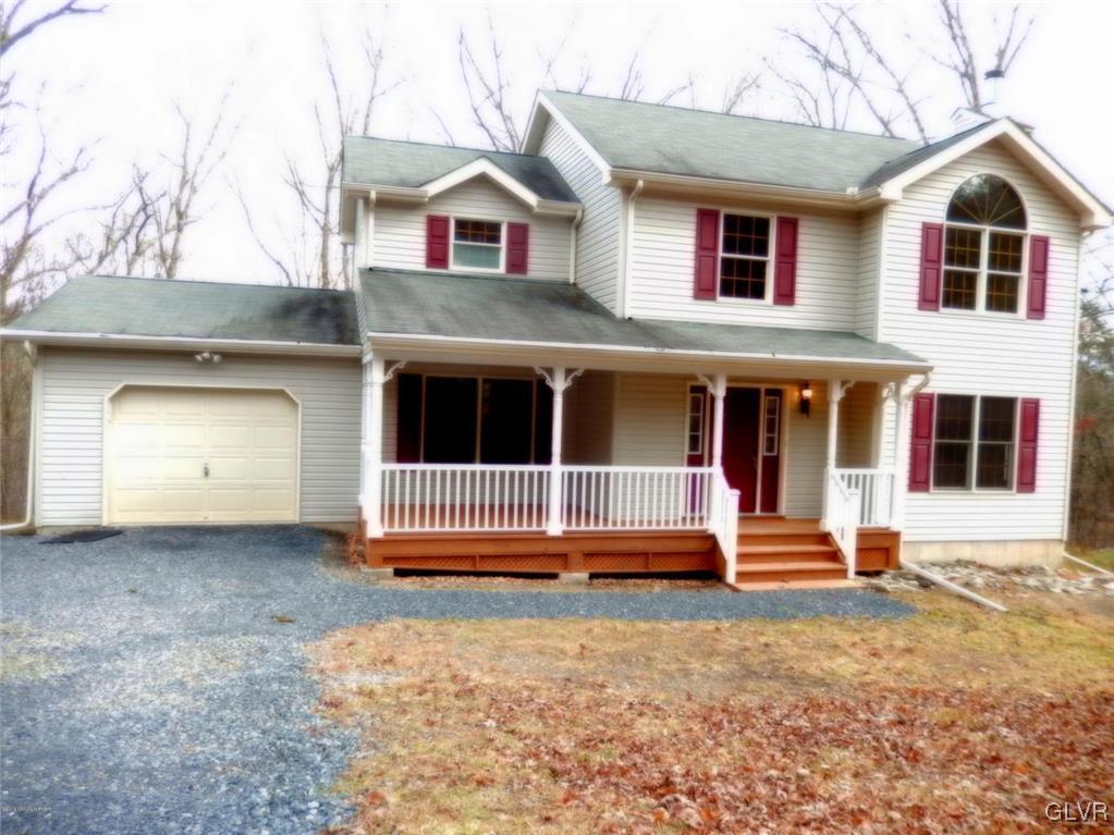 5886 Decker Road Bushkill, PA 18324 - Photo 2 of 15 a front view of a house with a yard