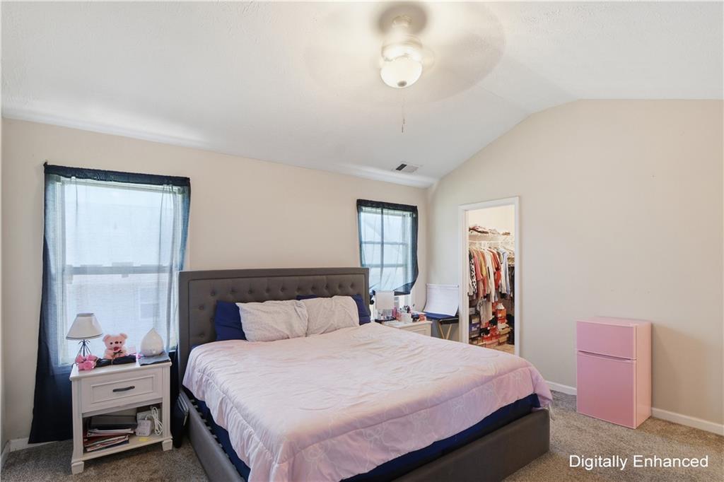 2555 Flat Shoals Road, Unit 2008 Atlanta, GA 30349 - Photo 22 of 33 a bedroom with a bed and a window