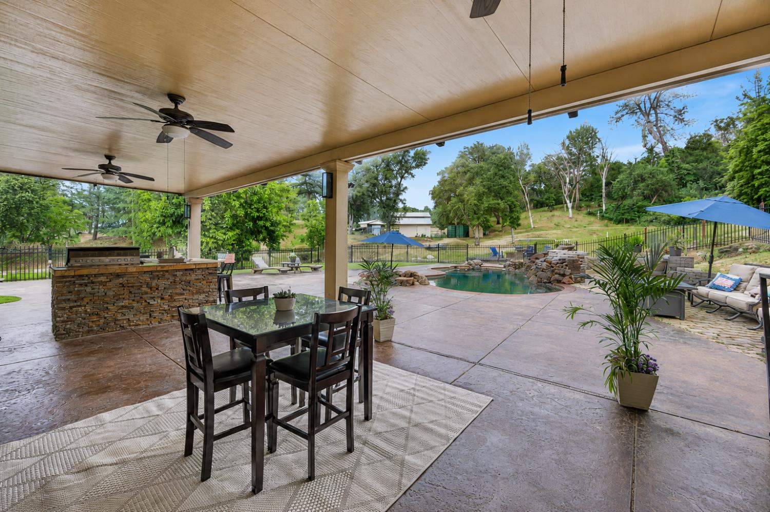 3340 Garden Bar Road Lincoln, CA 95648 - Photo 53 of 56 a view of a patio with a table chairs and a garden