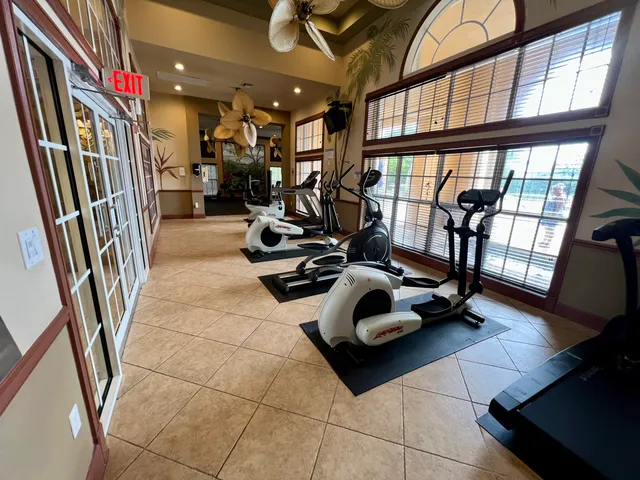 a room with furniture and a floor to ceiling window