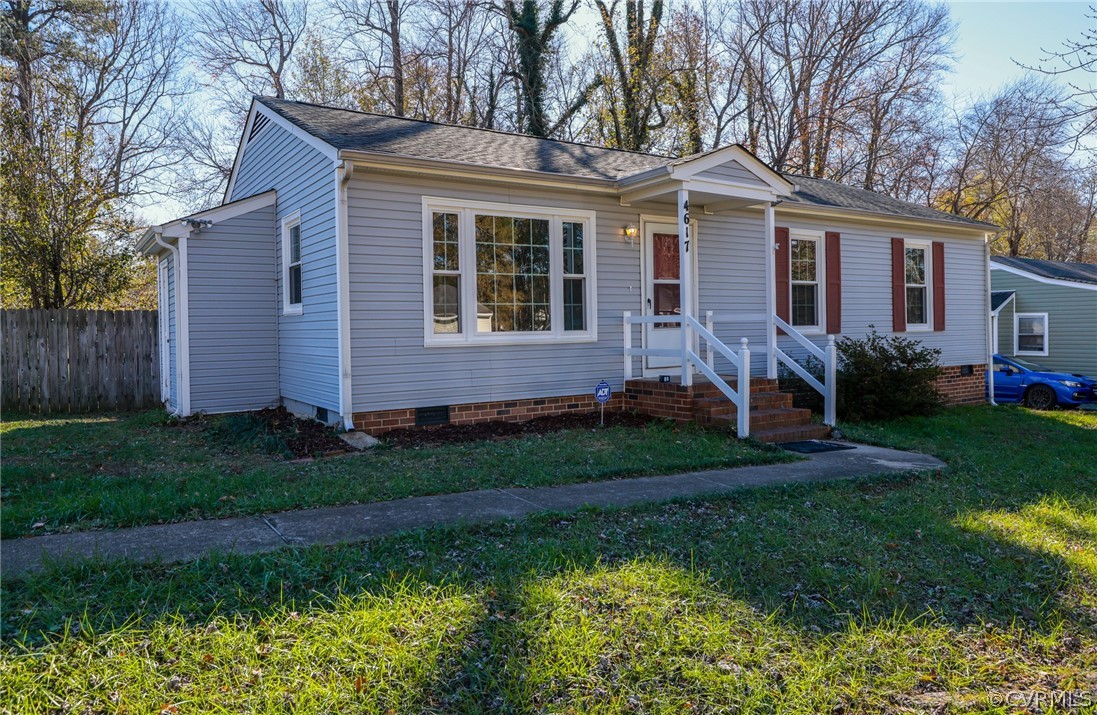 4617 Twelveoaks Road Midlothian, VA 23112 - Photo 3 of 42 a front view of a house with a garden and yard