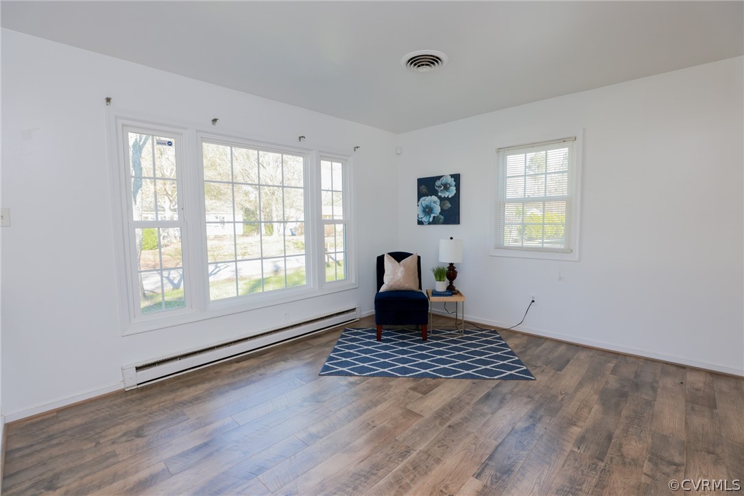 4617 Twelveoaks Road Midlothian, VA 23112 - Photo 8 of 42 a view of an empty room with a window and wooden floor