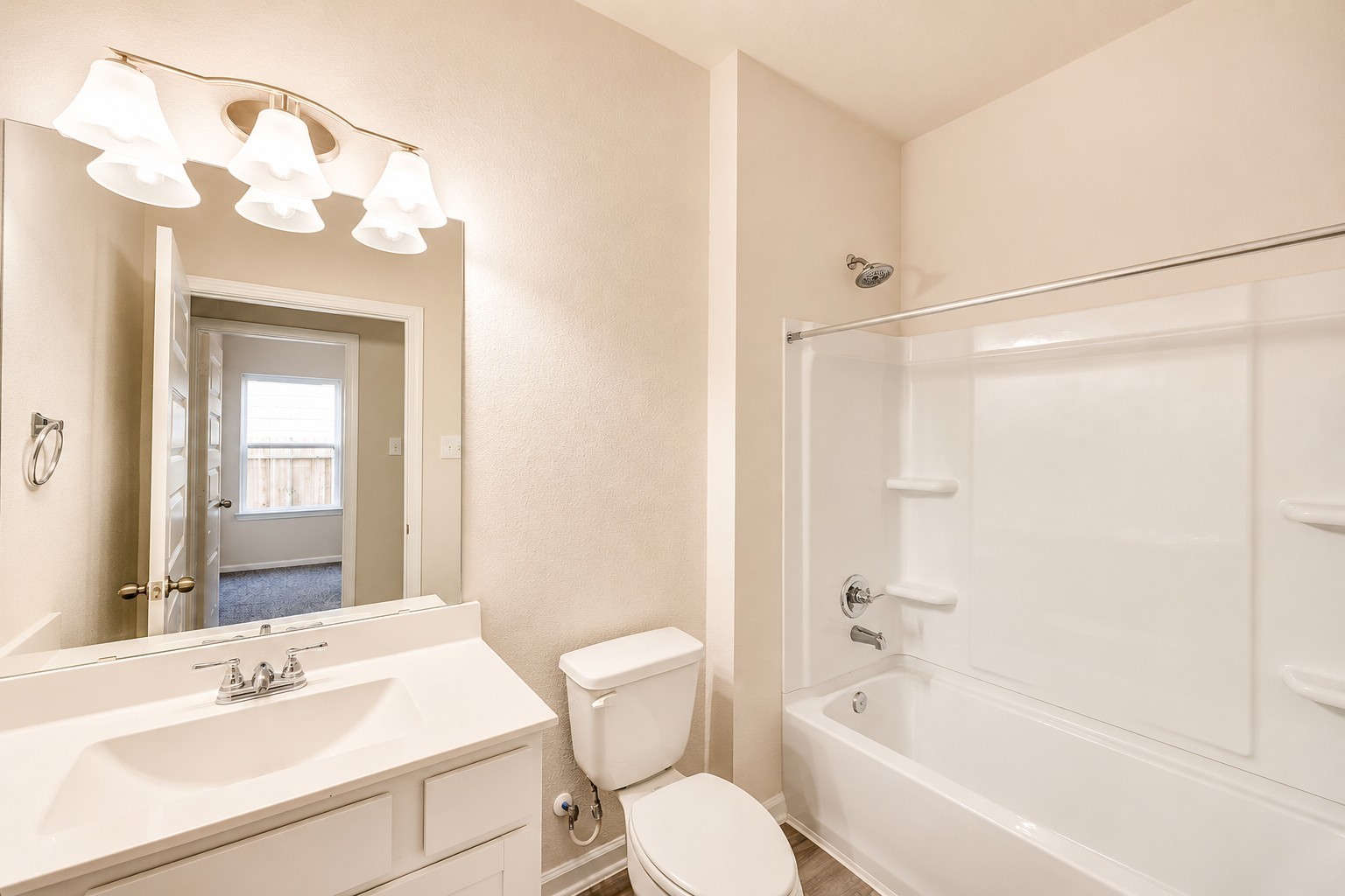 1929 North Riverside Circle Dayton, TX 77535 - Photo 13 of 21 Bathroom-A bright, well-maintained full bathroom offering a generous vanity, large mirror, and a convenient tub-and-shower combination.