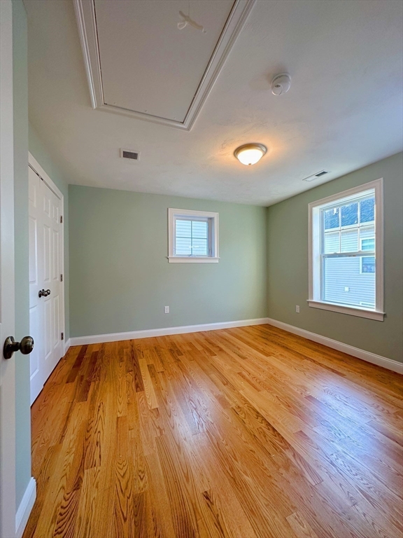 1400 Gorham Street, Unit 36 Lowell, MA 01852 - Photo 11 of 17 a view of empty room with wooden floor and fan