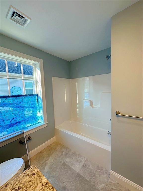 1400 Gorham Street, Unit 36 Lowell, MA 01852 - Photo 13 of 17 a bathroom with bathtub and shower