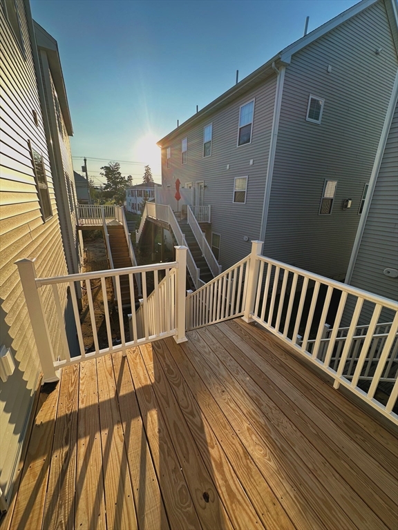 1400 Gorham Street, Unit 36 Lowell, MA 01852 - Photo 3 of 17 a view of balcony with wooden floor