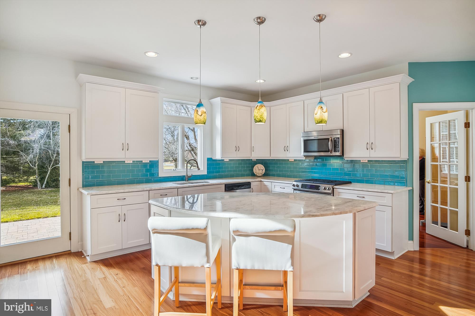 2802 Cox Neck Road Chester, MD 21619 - Photo 14 of 55 a large kitchen with lots of counter space and wooden floor