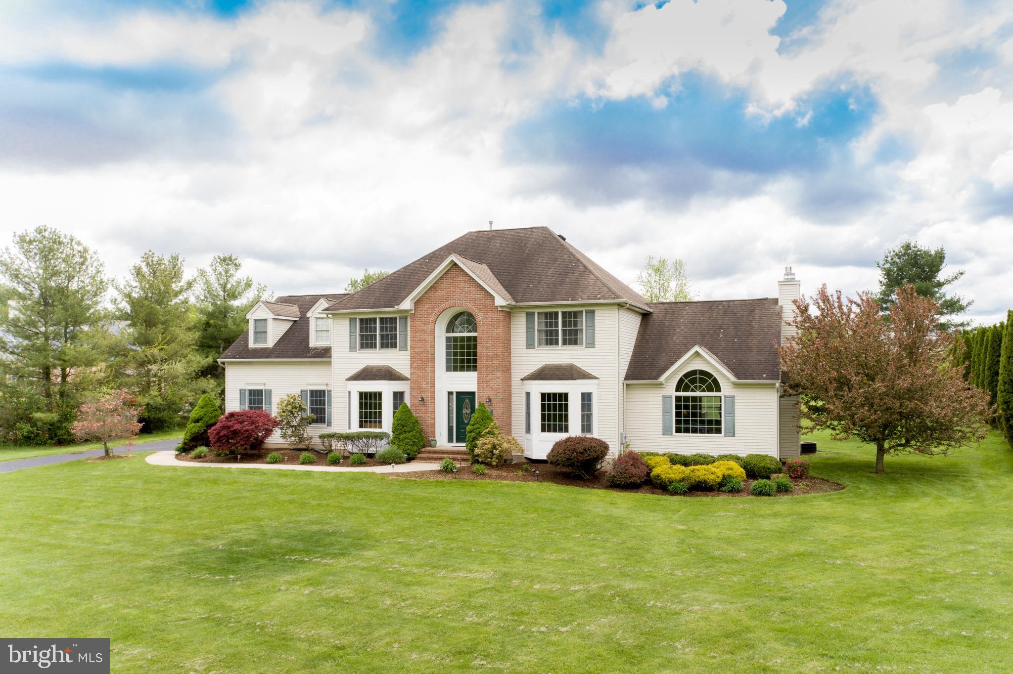 Center Hall Colonial Home situated on an Acre