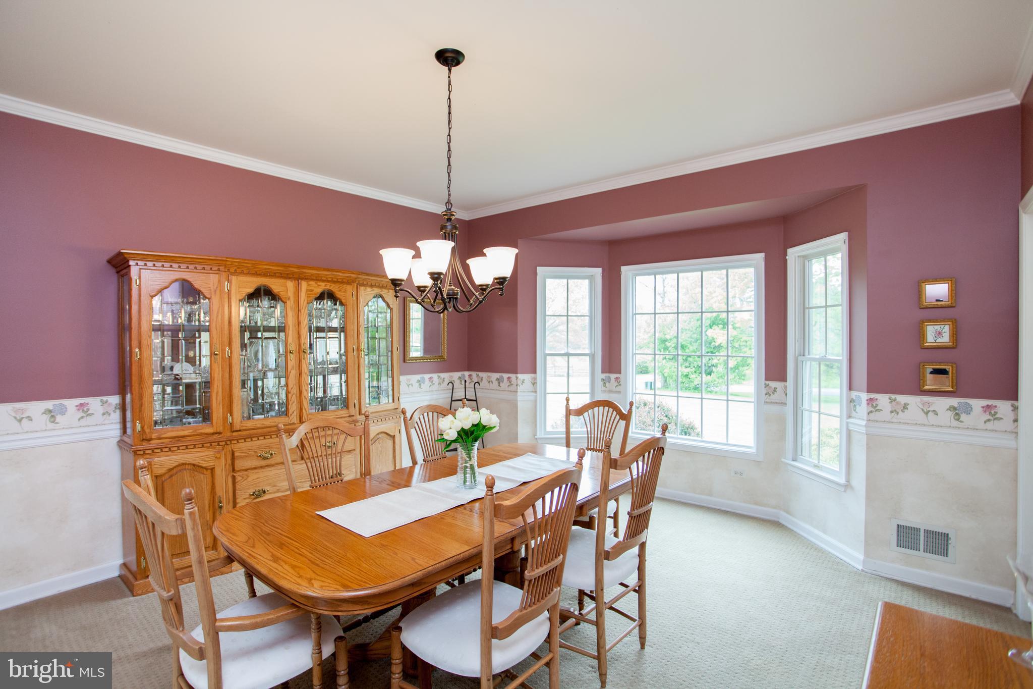 Dining Room features Crown Molding & Chair Rail