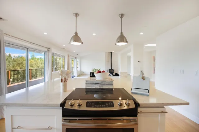 an empty room with a ceiling fan and a window