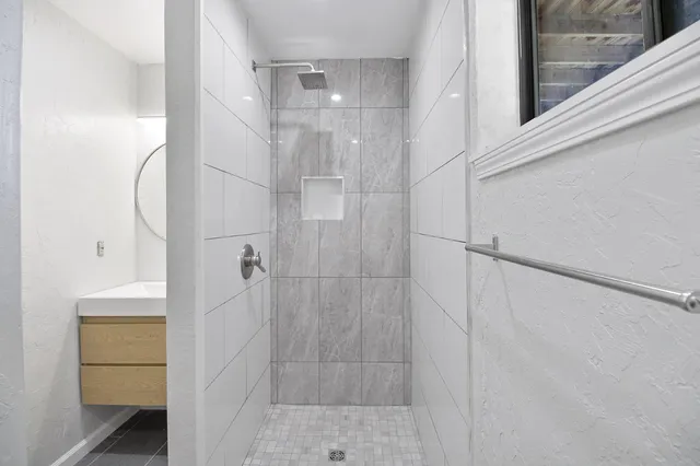 a view of a yard with snow on the road