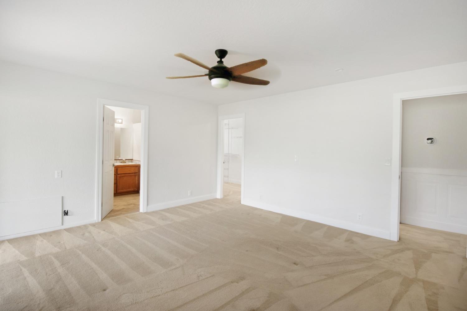 1276 Coon Court Cool, CA 95614 - Photo 36 of 79 a view of a livingroom with a ceiling fan and window
