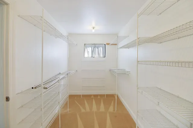 an aerial view of multiple houses with a yard