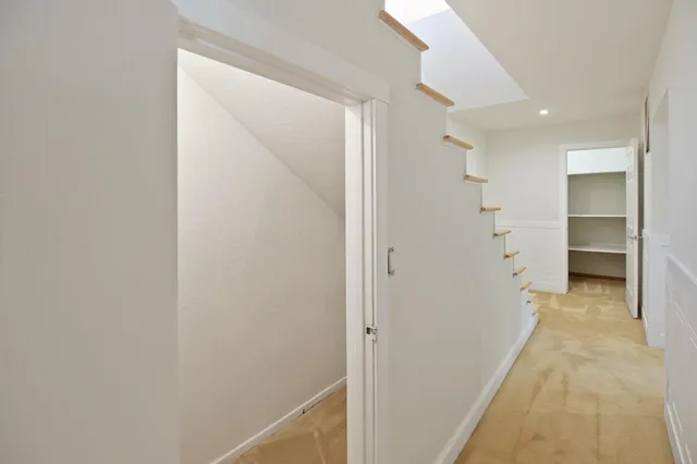 an aerial view of a house with a yard and trees