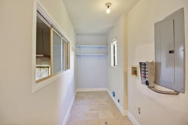 an aerial view of a house with a garden and swimming pool