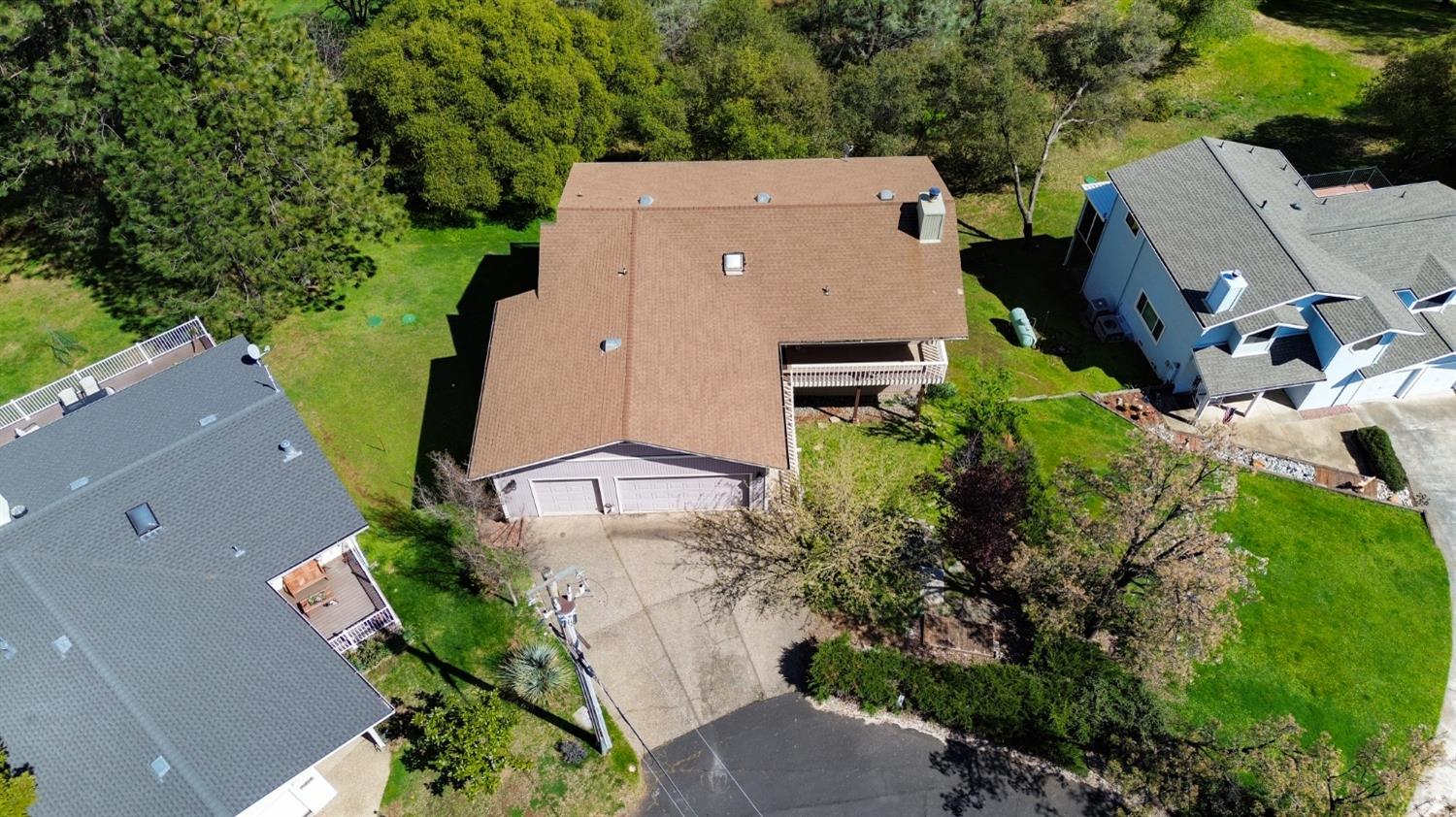 1276 Coon Court Cool, CA 95614 - Photo 61 of 79 an aerial view of a house with a yard and trees