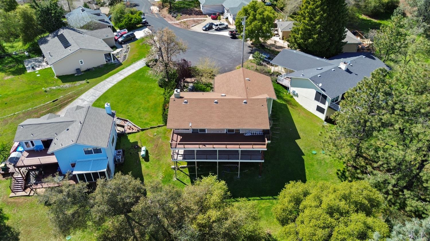 1276 Coon Court Cool, CA 95614 - Photo 63 of 79 an aerial view of a house with a garden and swimming pool