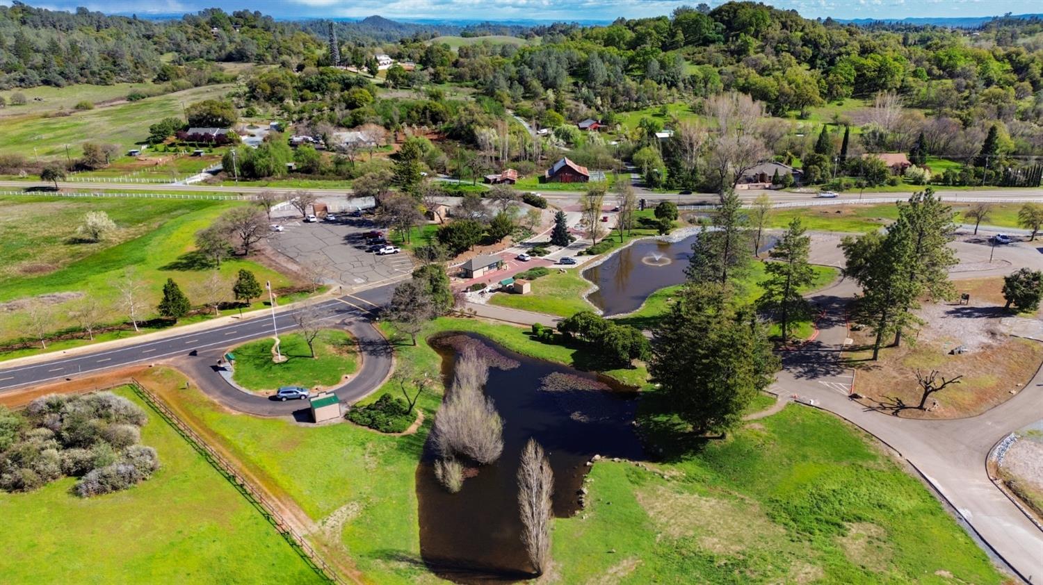 1276 Coon Court Cool, CA 95614 - Photo 70 of 79 an aerial view of a golf course with parking space