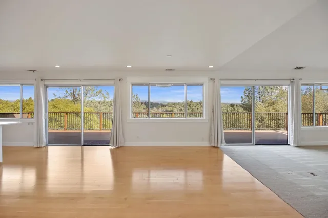 a view of kitchen with furniture and wooden floor