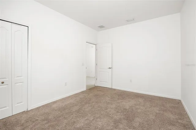 a bathroom with a granite countertop shower sink and mirror
