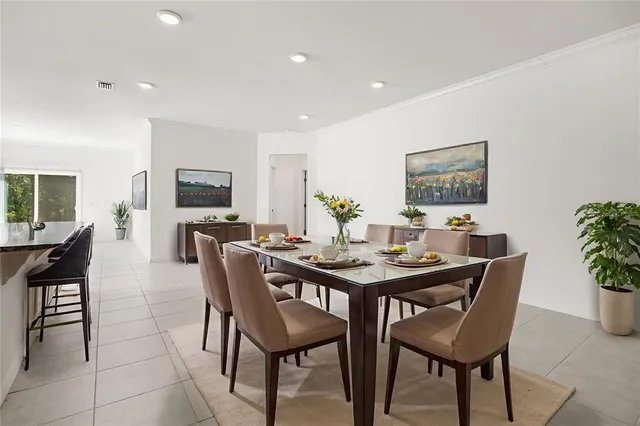 a bedroom with a bed and a potted plant