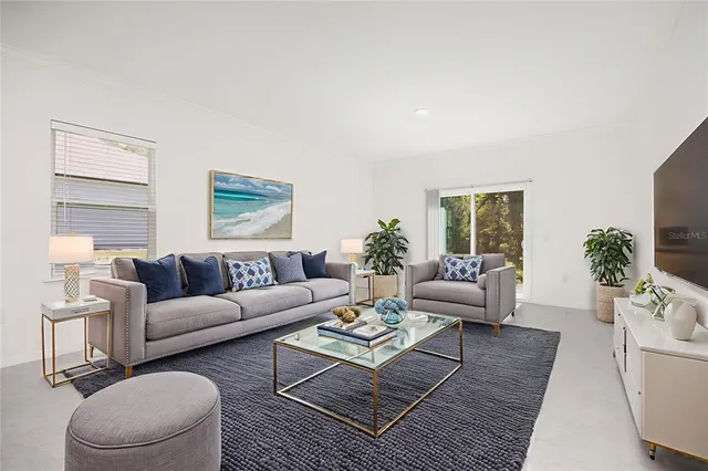a living room with furniture and a large window